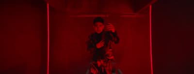 a man taking a picture of himself in a red room