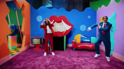 a couple of people that are standing in a room
