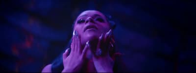 a woman with her hands on her face