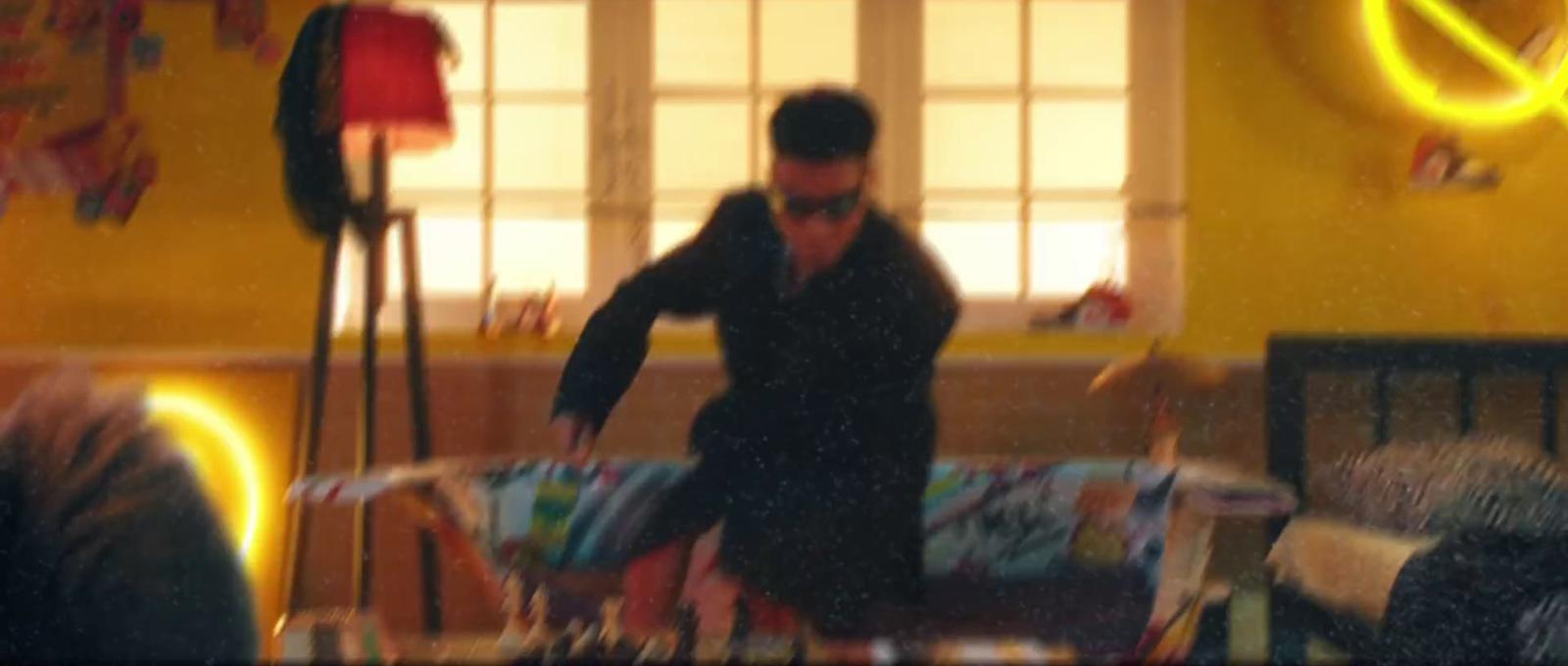 a blurry photo of a man in a living room