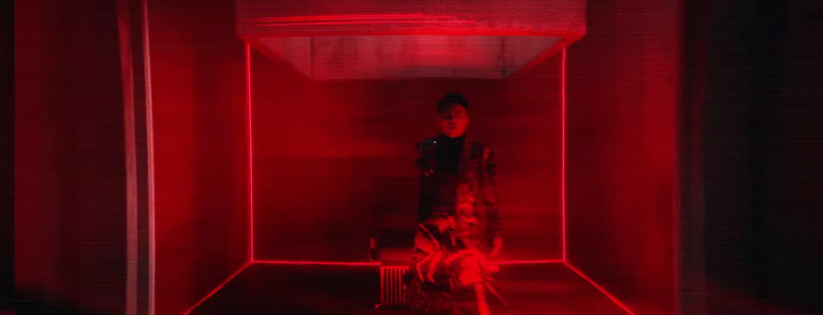 a person standing in a room with red light