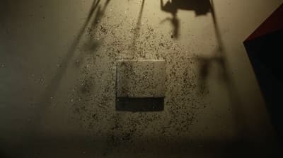 a shadow of a person on a wall