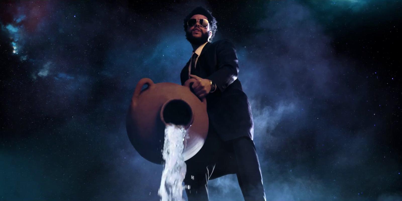a man in a suit and tie holding a large object