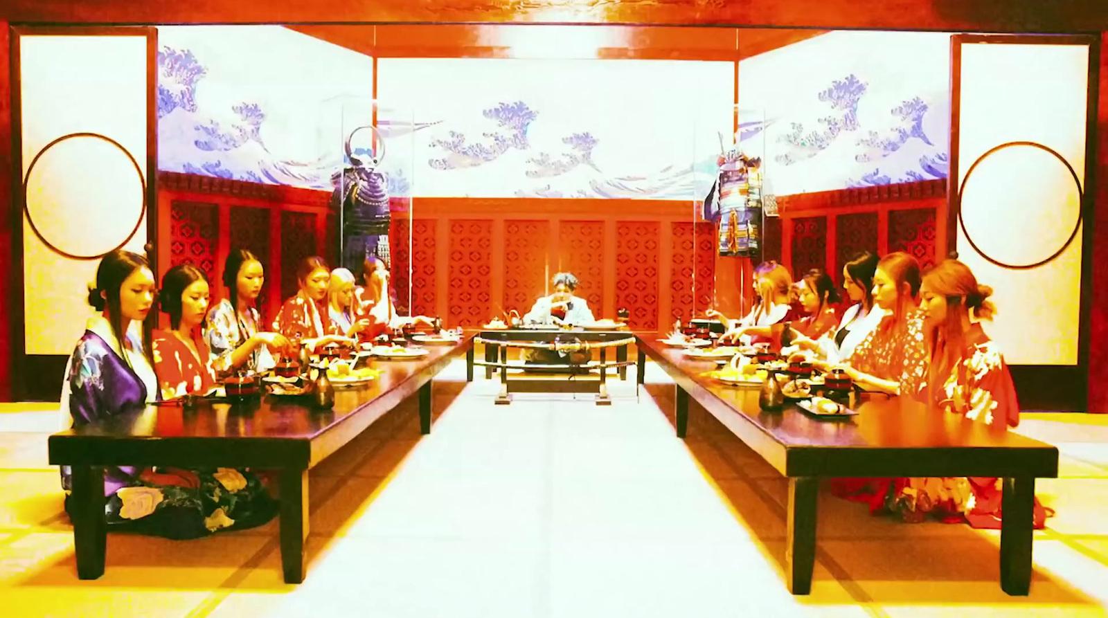 a group of women sitting at a long table