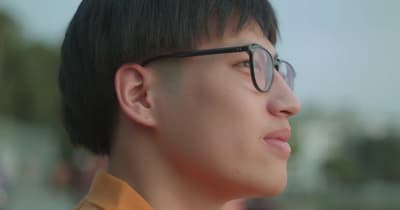 a close up of a person wearing glasses