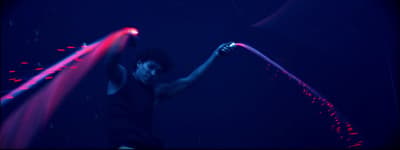 a man holding a neon colored object in his hands