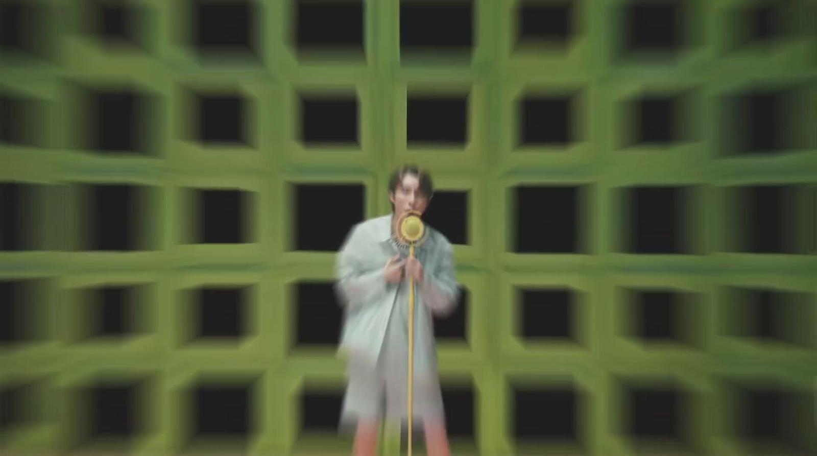 a blurry photo of a woman holding a gold medal