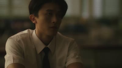 a man in a white shirt and black tie
