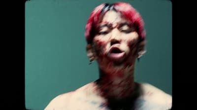 a man with his face covered in blood
