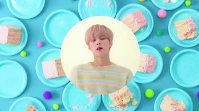 a picture of a person with a cake in front of them
