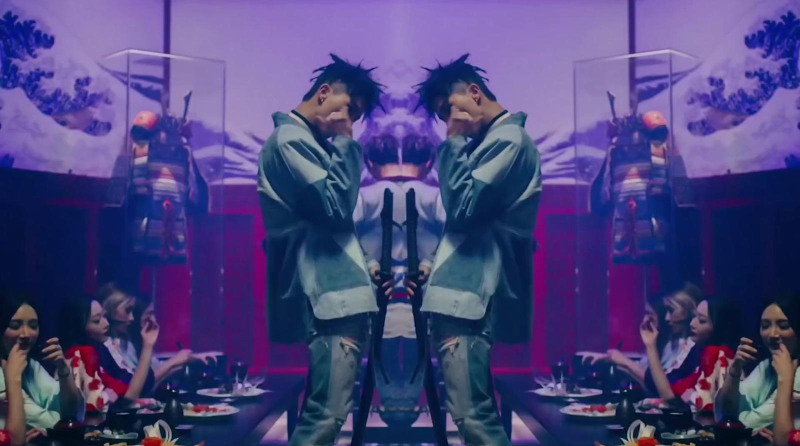 a man standing in front of a mirror in a room