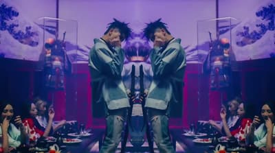 a man standing in front of a mirror in a room