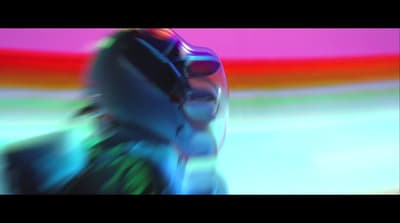a blurry image of a person wearing a helmet