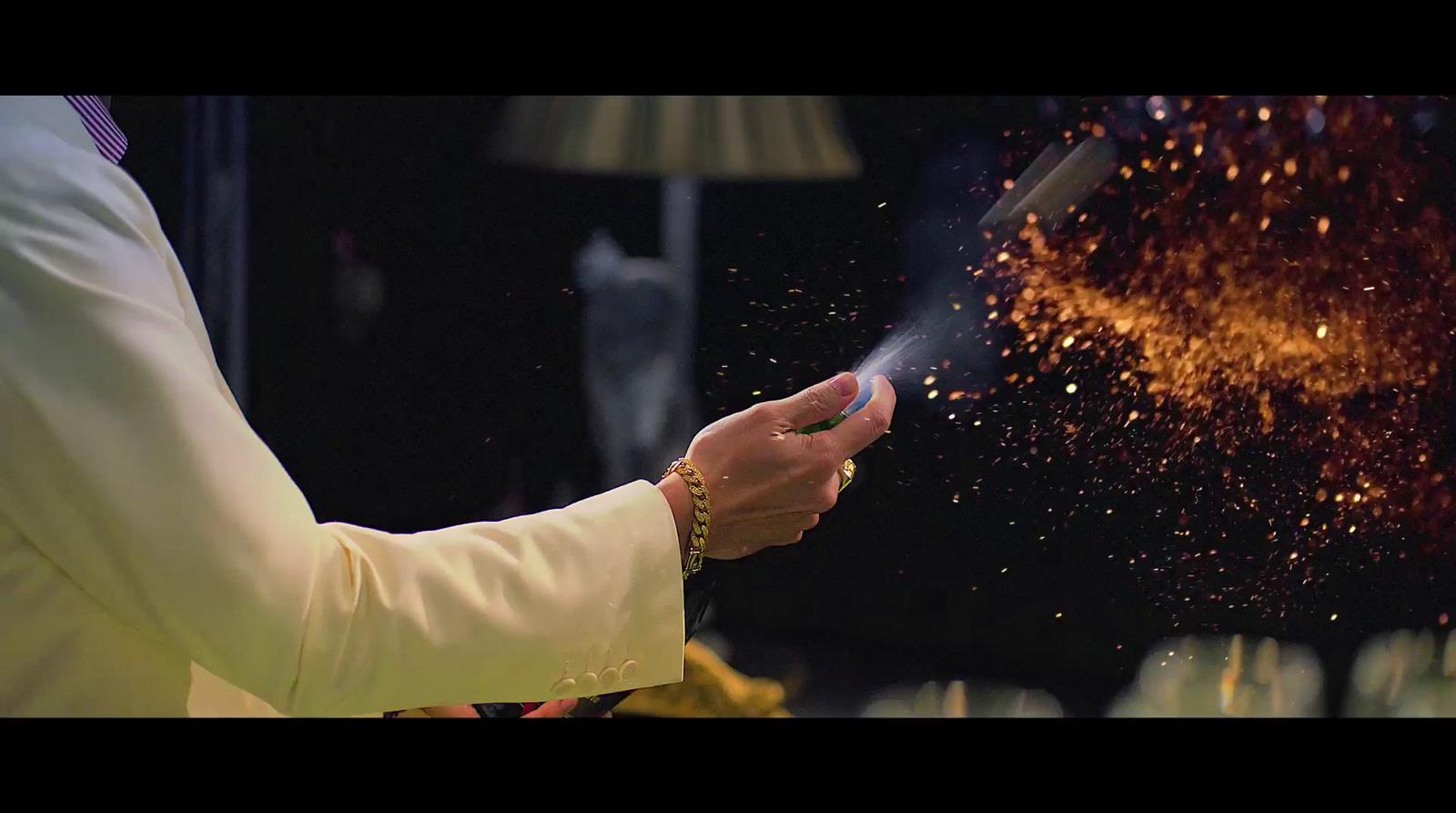 a person in a priest's robe holding a lit candle