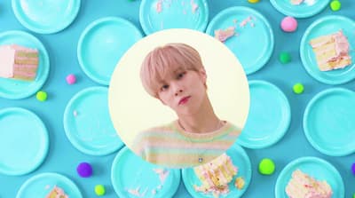a picture of a boy surrounded by blue plates
