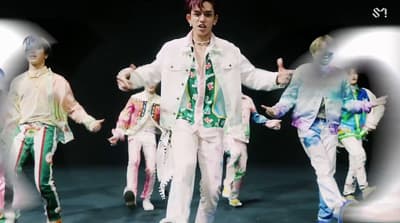 a group of young men dancing on stage