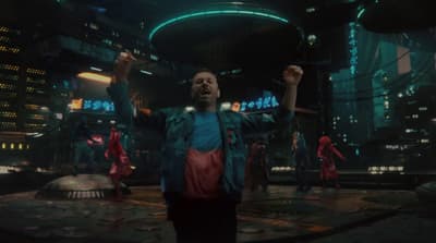 a group of people in a futuristic city