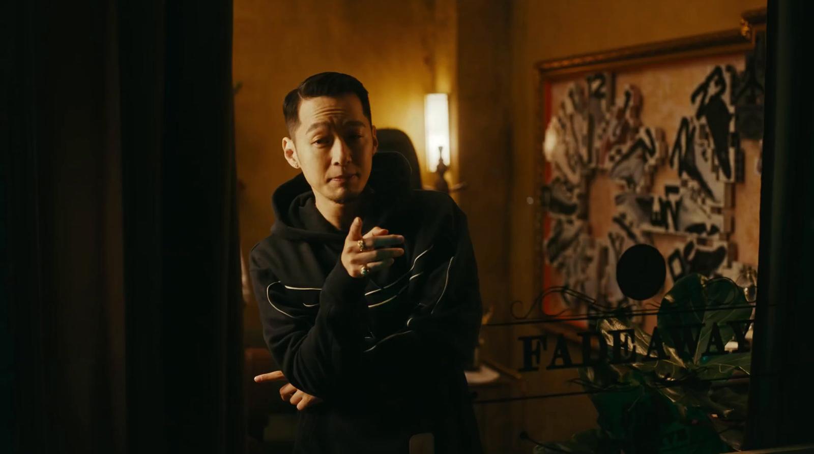 a man standing in front of a mirror in a room