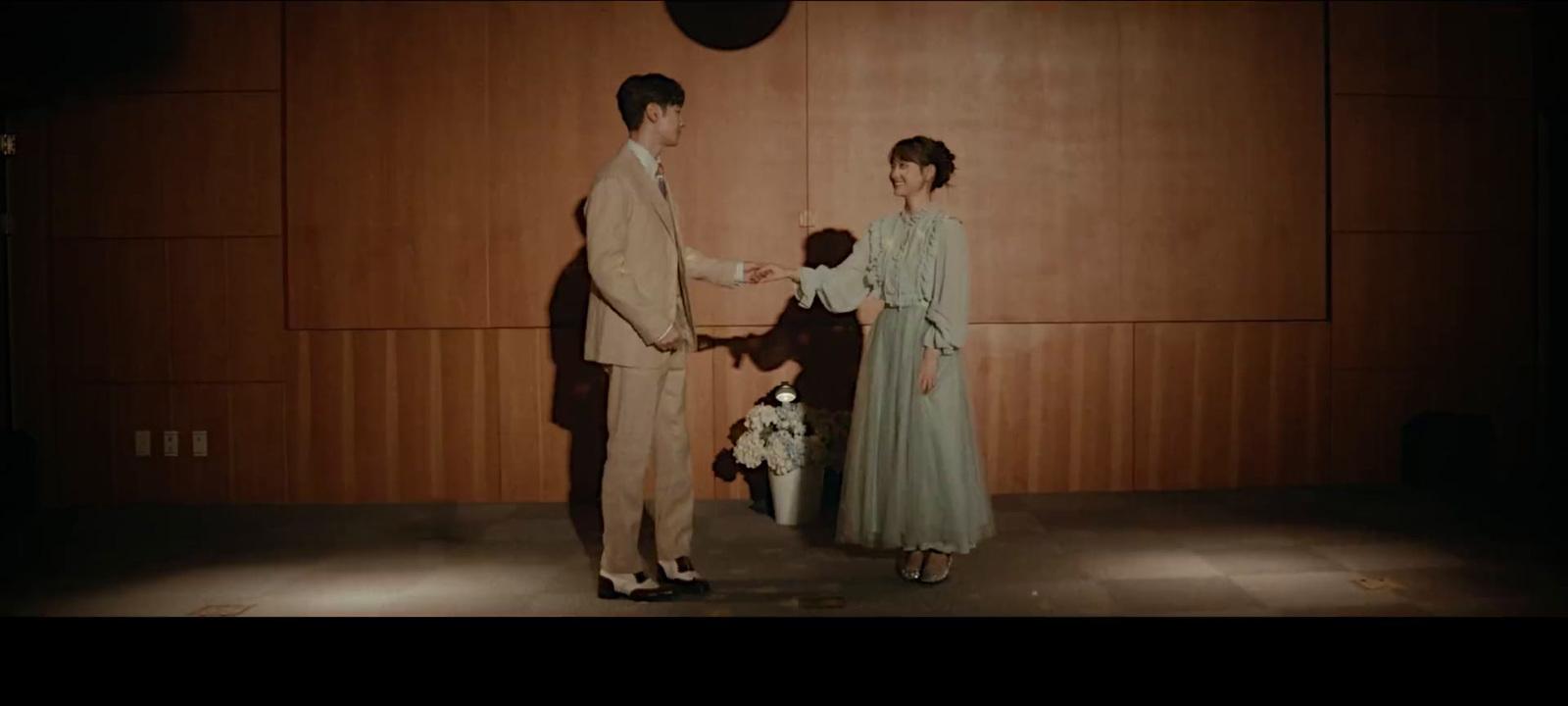 a man and a woman standing next to each other