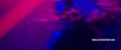 a blurry image of a person in a dark room