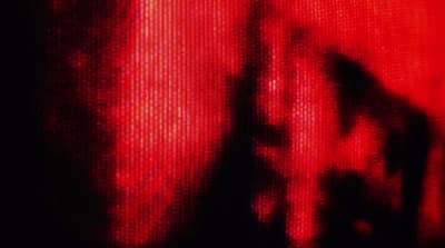 a blurry image of a person's face in red