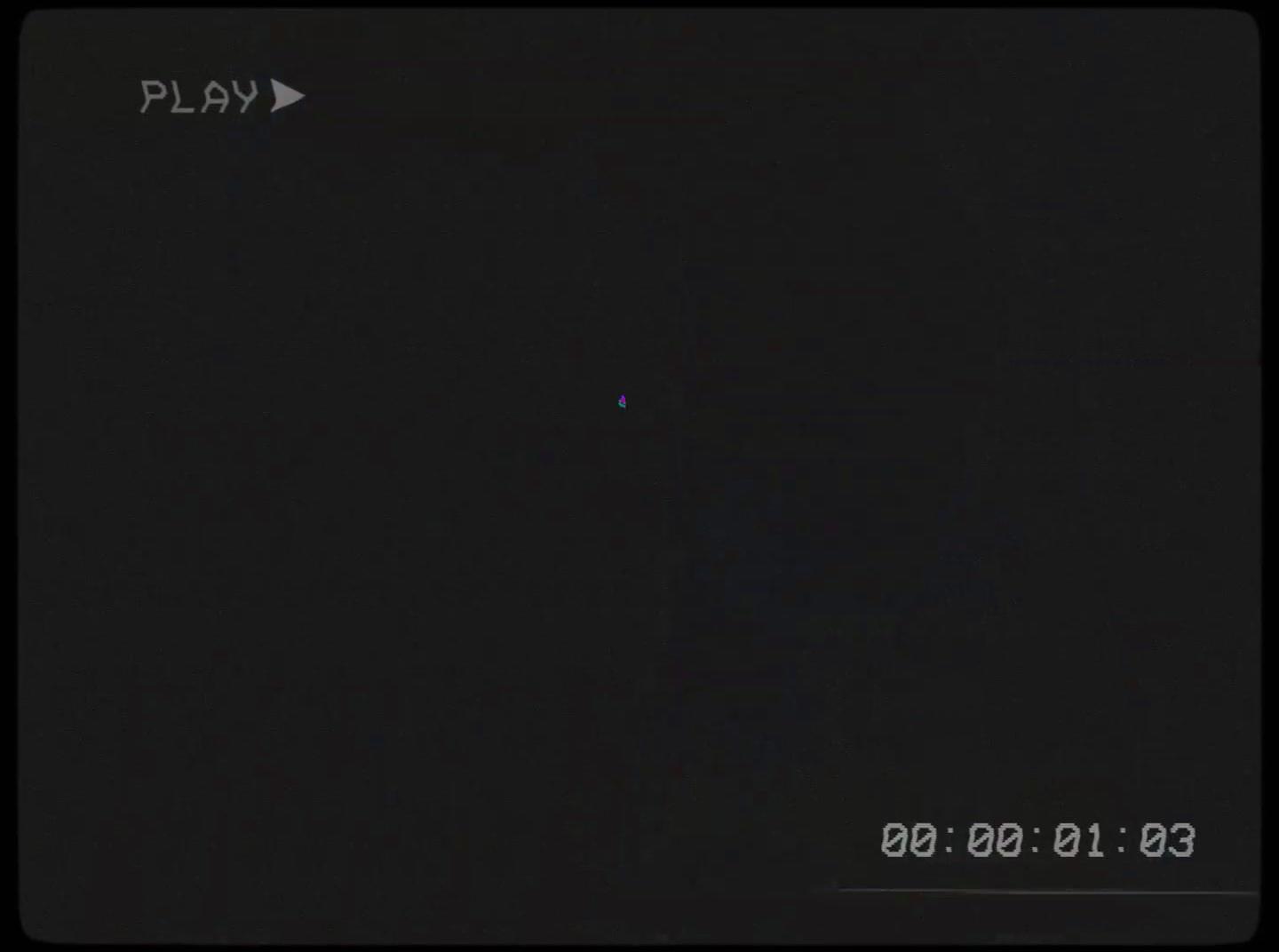 a dark picture of a plane flying in the sky