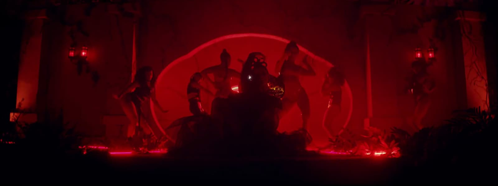 a red light is shining on a stage