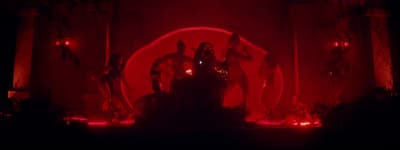 a red light is shining on a stage