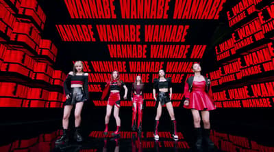 a group of women standing next to each other on a stage