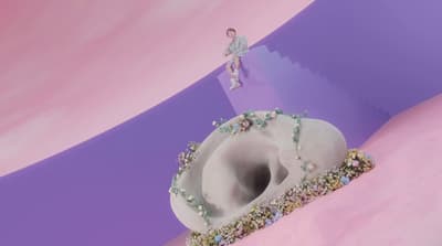 a large white object with a person standing on top of it