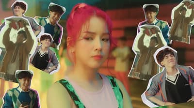a girl with pink hair and a boy with blue eyes