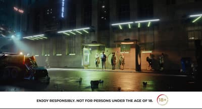 a group of people standing outside of a building at night