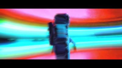 a blurry photo of a person holding a cell phone