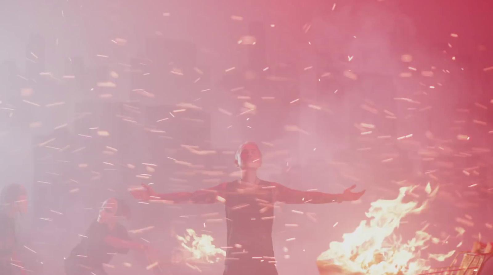 a person standing in front of a fire