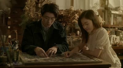 a man and a woman sitting at a table