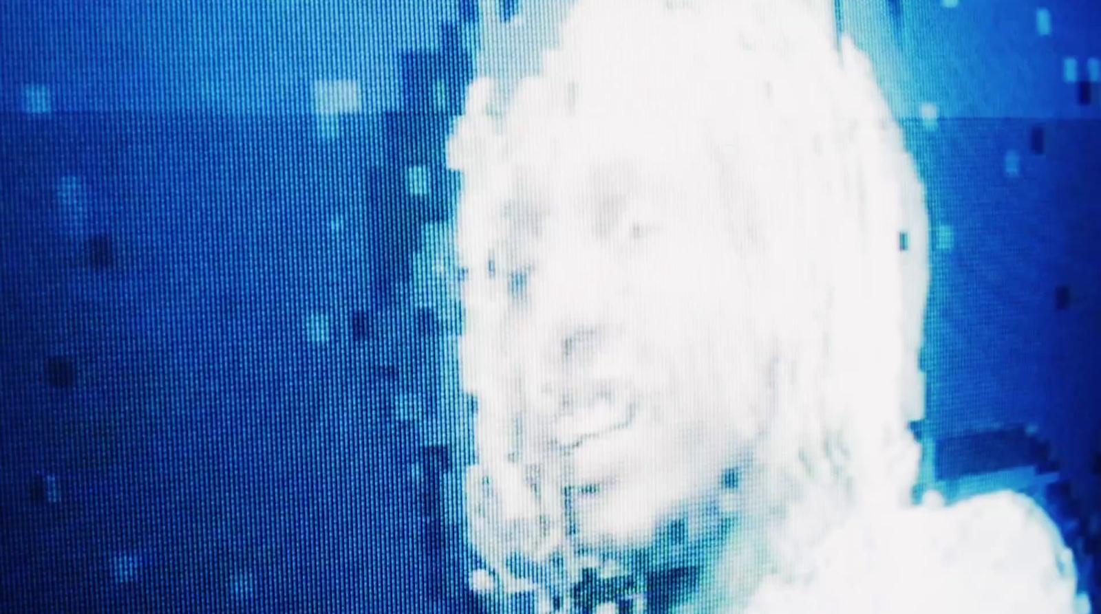 a blurry photo of a woman's face and hair