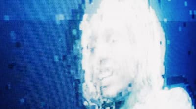 a blurry photo of a woman's face and hair
