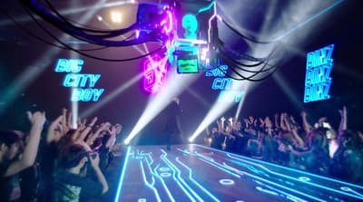 a crowd of people standing on top of a stage