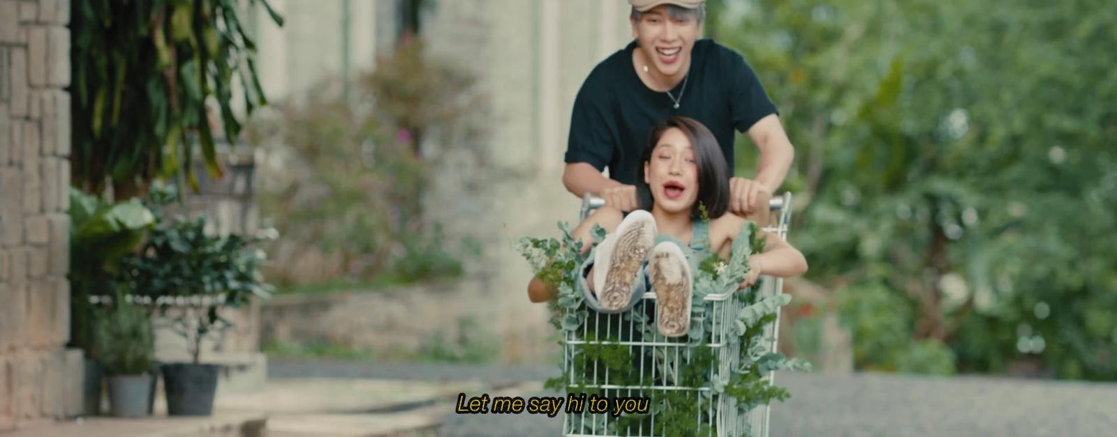 a man pushing a child in a shopping cart
