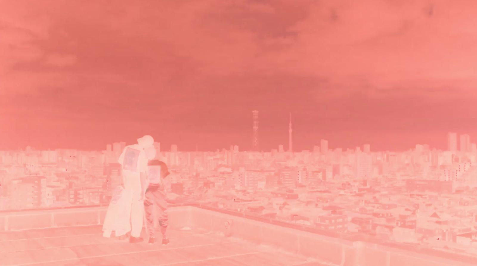 a couple of people standing on top of a building