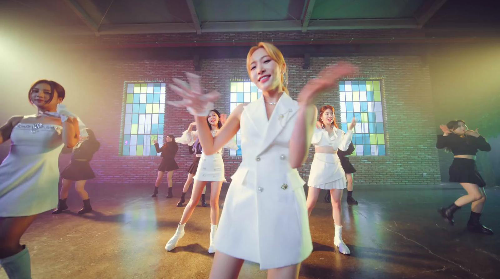 a woman in a white dress is dancing