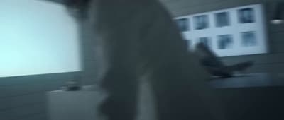 a blurry photo of a person standing in a room