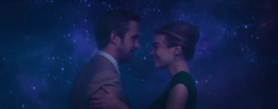 a man and a woman standing next to each other