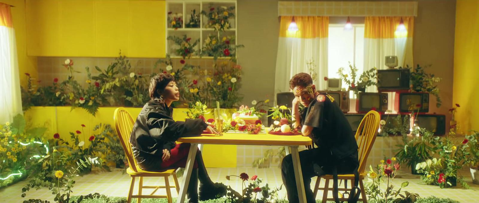 a couple of people sitting at a table