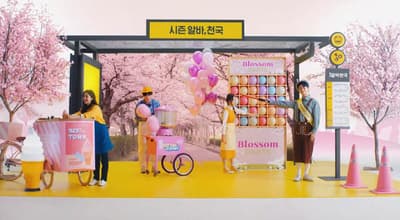 a group of people standing in front of a display