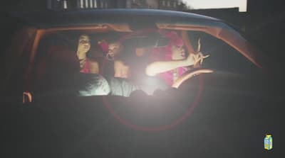 a group of people sitting in the back of a car