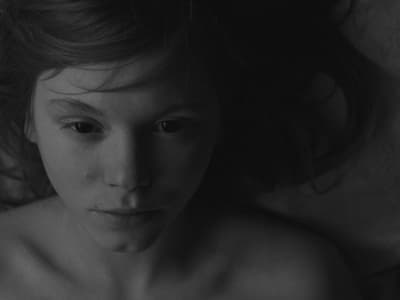 a black and white photo of a naked woman