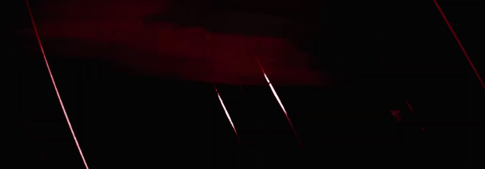 a black and red photo of a street light