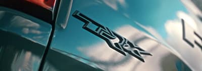 a close up of a car with a sky background