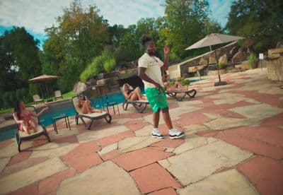 a man standing in front of a swimming pool